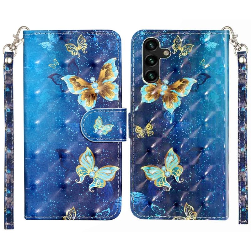 Fodral För Samsung Galaxy S25 Fe Blå Och Guldfärgade Fjärilar Med Snodd